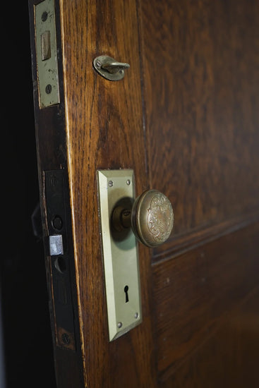 32x80 in. 2-Panel vintage door with elegant Rosette design on doorknob.